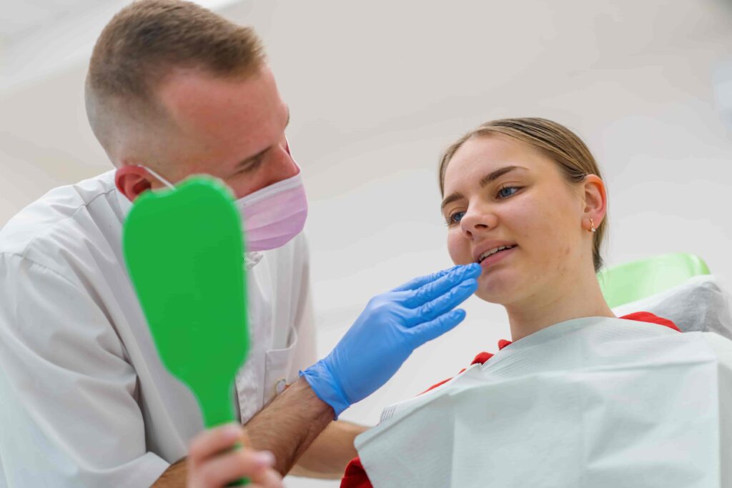 Dental team preparing to examine a patient who appears nervous
