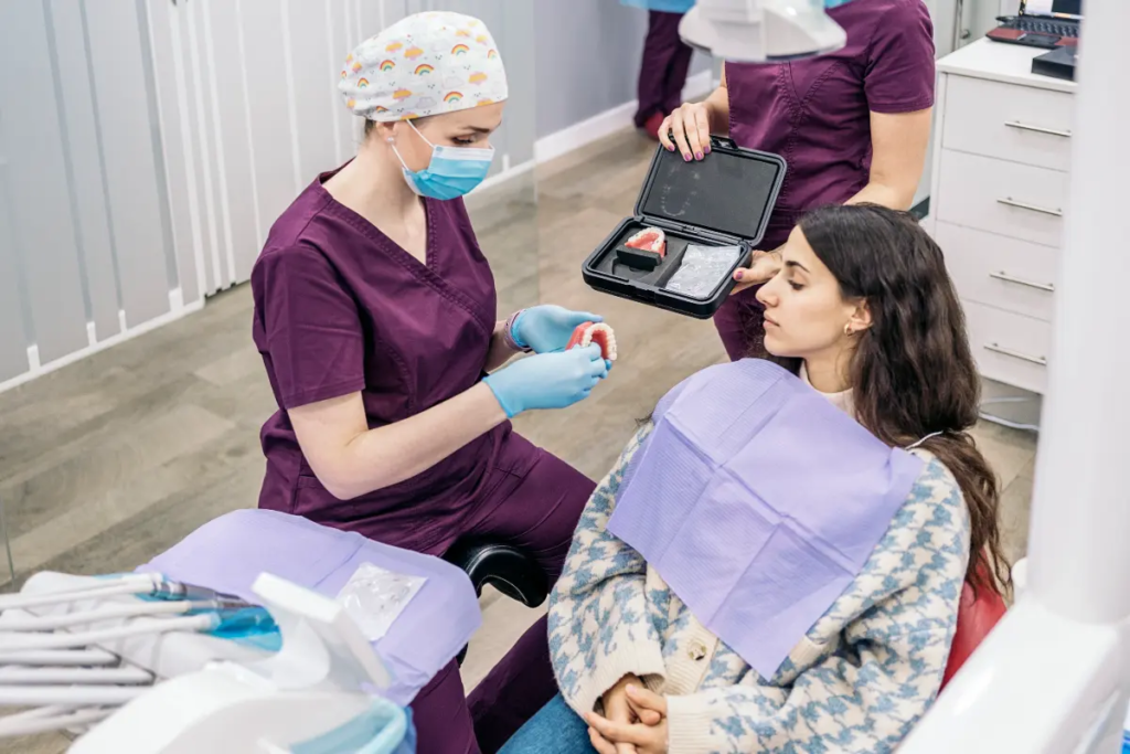 A sedation dentist explains a dental procedure to a nervous patient. 