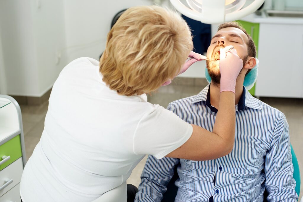 Dentist examining patient during a routine dental checkup in Alexandria, VA