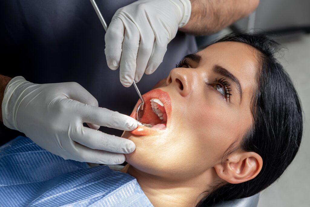 Woman receiving professional dental treatment to improve gum health